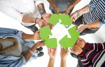 Group of People Holding Recycling Sign Concept